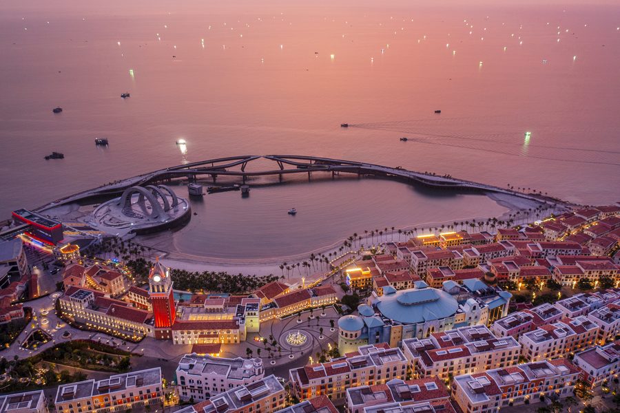 Aerial view of Kiss Bridge and Sunset Town at dusk on Phu Quoc Island, Kien Giang Province, Vietnam