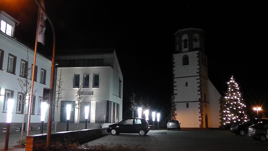Town hall of Neuhausen in the Enzkreis with the marketplace and Catholic church in the background