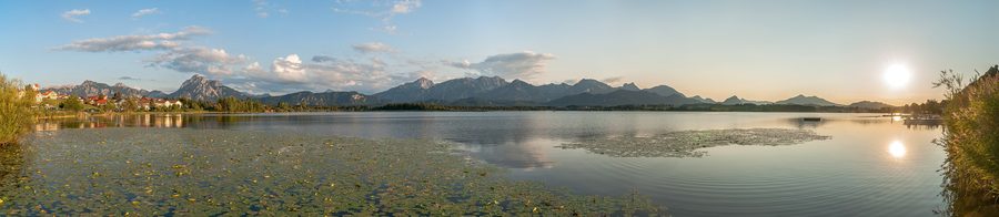 Lake Hopfensee with Hopfen am See and the Ammergau and Allgäu Alps in evening light