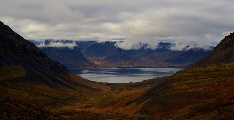 Rugged Westfjords coastline with steep mountains and a remote fjord setting in Iceland.