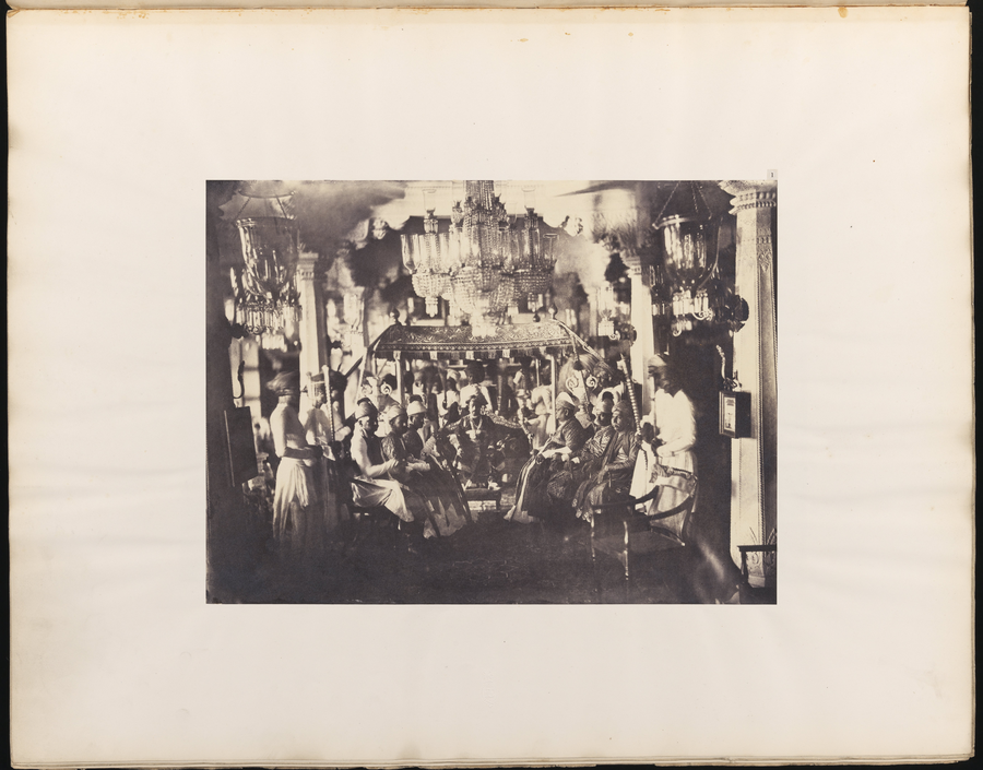 The Tondiman Rajah seated in the centre of a palace Durbar Hall, flanked by ministers.