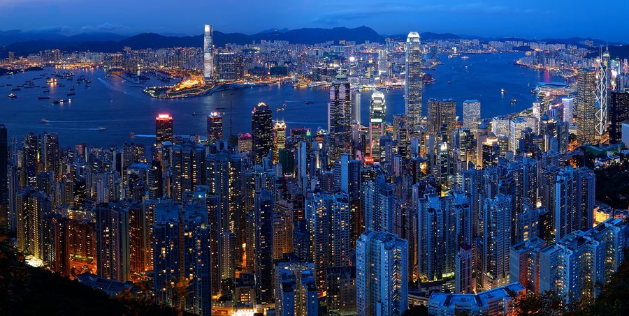 Hong Kong skyline and Victoria Harbour at dusk, seen from Victoria Peak.