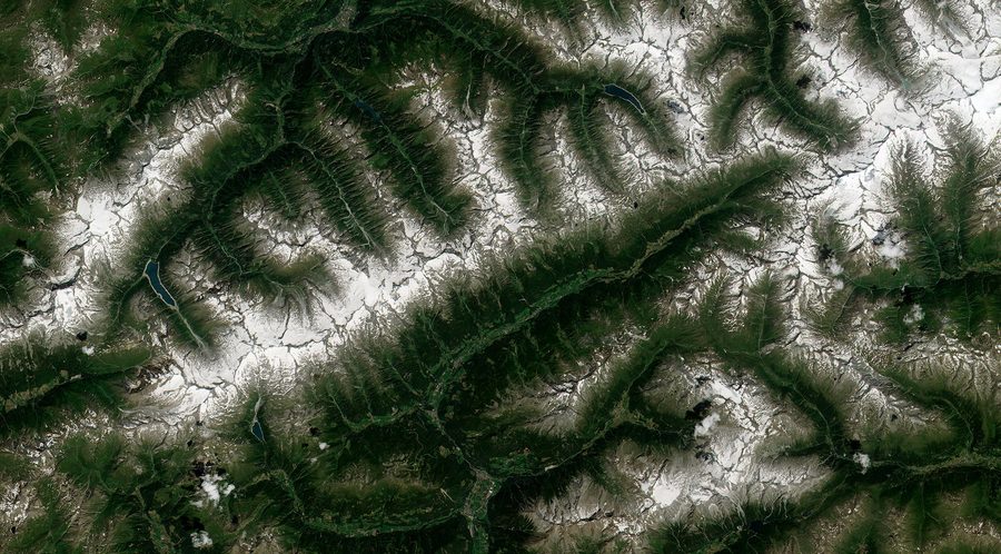Snow-capped ridges and lush green valleys of Valle Aurina, also known as Ahrntal, in South Tyrol