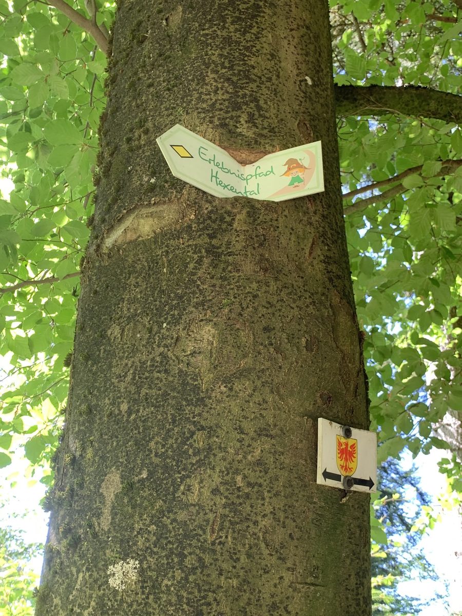 Signpost on the Hexental adventure path with informative boards and attractions