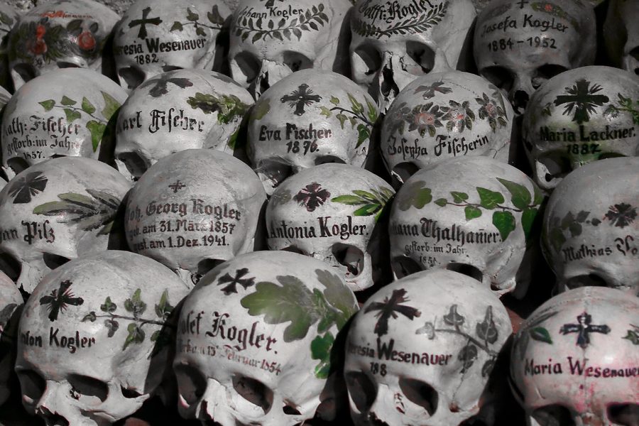 Painted skulls in the Hallstatt ossuary in the Salzkammergut, Upper Austria.