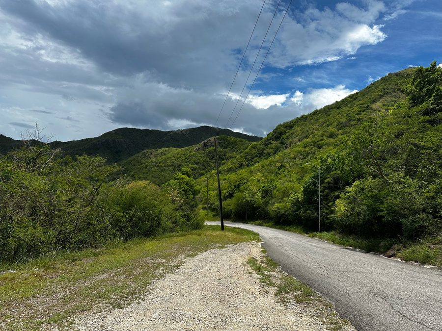 Green hills in the Shekerley Mountains near John Hughes Village, Saint Mary.
