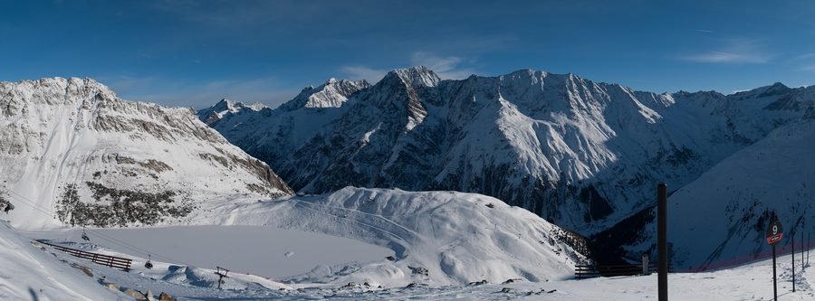 Alpine panorama with mountains and a frozen lake in the Pitztal, Tyrol.