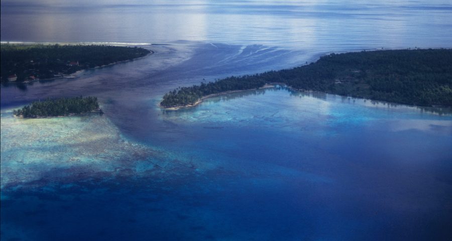 Entrance to the lagoon of Rangiroa Atoll in the Tuamotu Archipelago, with turquoise water and reef line.
