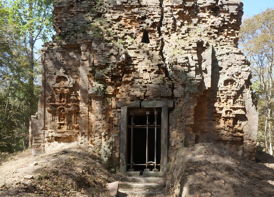 Ancient temple sanctuary ruins at Sambor Prei Kuk surrounded by trees.