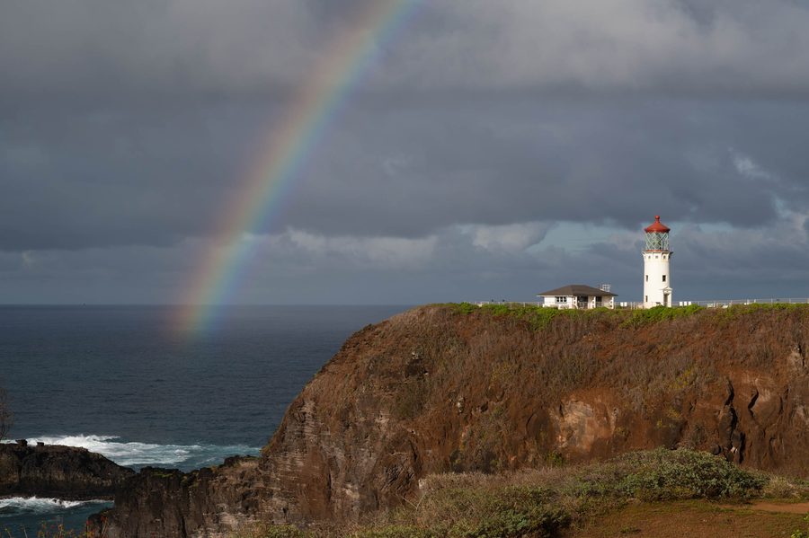 Daniel K. Inouye Kīlauea Point Lighthouse under a rainbow at Kīlauea Point National Wildlife Refuge on Kauaʻi